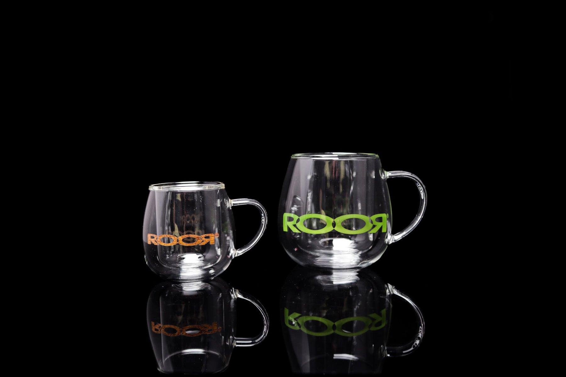ROOR® Glass Mugs Double Layer in different sizes with colorful decals on a black background.