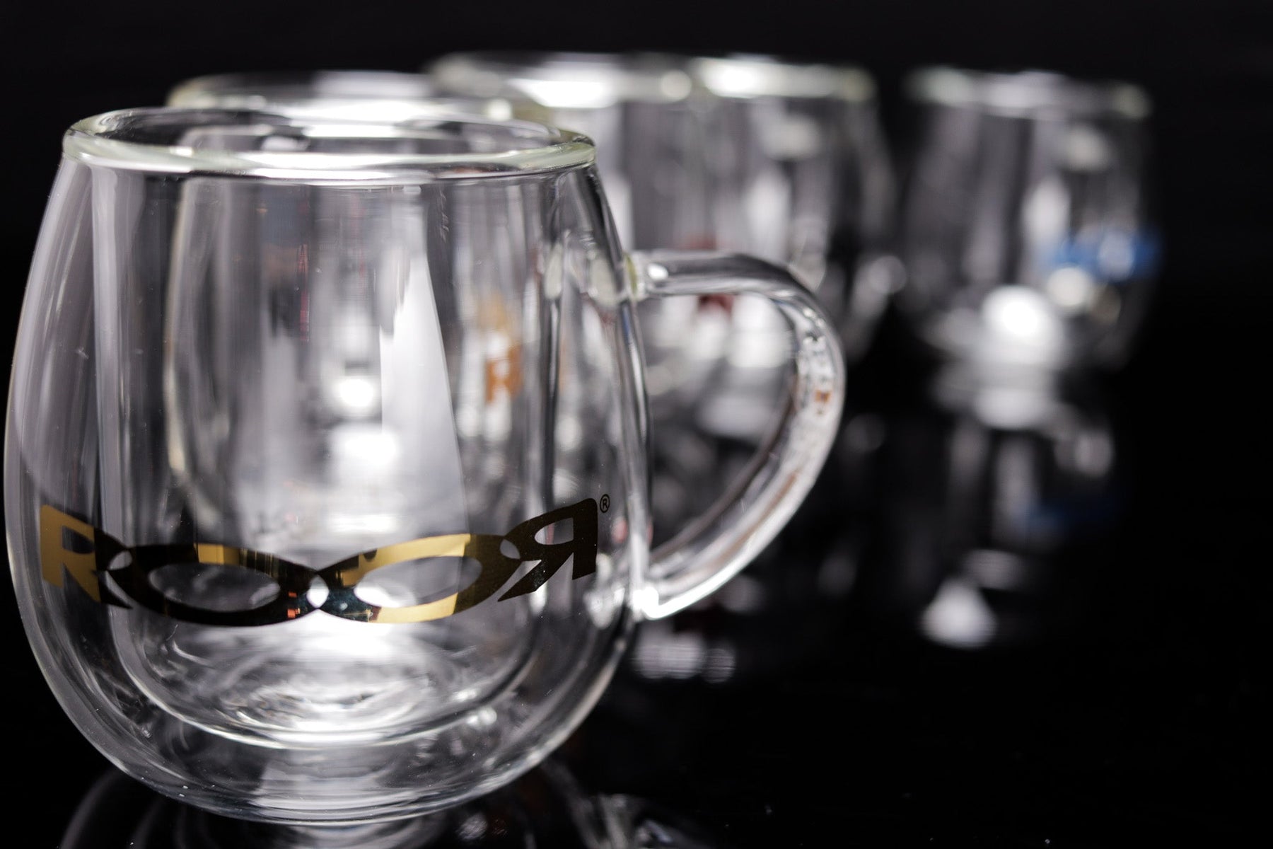 ROOR® Glass Mugs Double Layer with sleek double-walled design on black background.